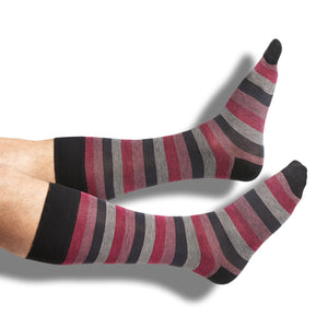 one pair of black dress socks with pink and grey mini stipe colorblock design on legs