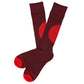 1 pair of dress socks lay flat crossed at the ankle in solid dark red with alert red large circle design on the calf