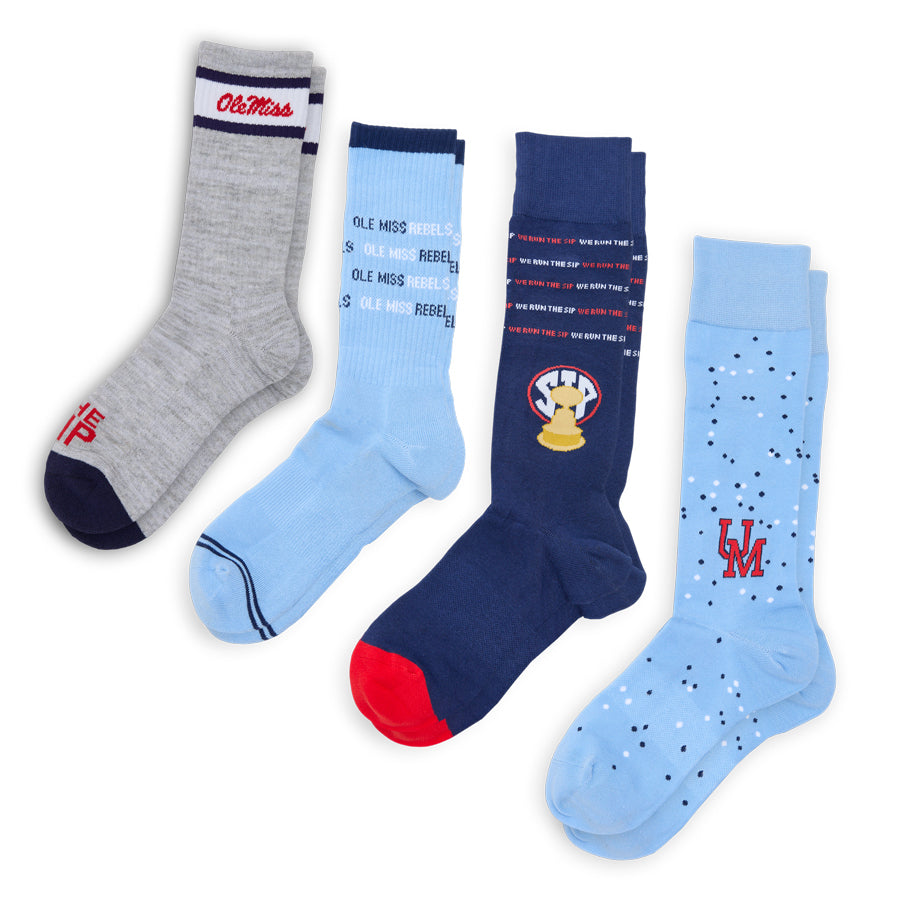 Bundle image showing four Ole Miss socks: two dress socks and two casual crew socks in navy, grey, and powder blue Ole Miss designs.