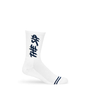 White casual crew socks with THE SIP in navy written down the leg laid out flat.