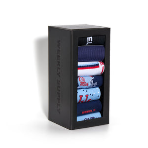 Black gift box with stacked pairs of socks featuring various designs from the Vaught Ole Miss sock collection.