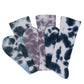 3 premium DeadSoxy Tie-Dye casual crew socks laid out flat in a spiral in a mixture of white, grey and blue colors.