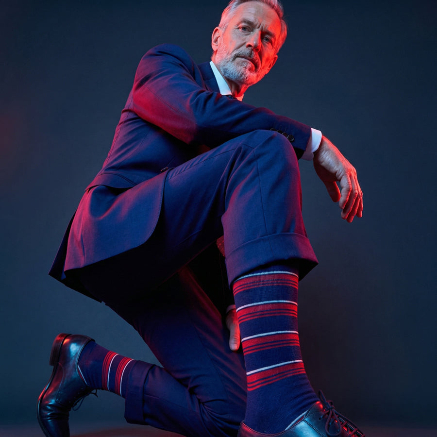 Tommy navy red and white stripe dress socks under neon lighting