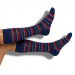 DeadSoxy Tommy dress socks in navy with red and white stripe pattern worn on foot