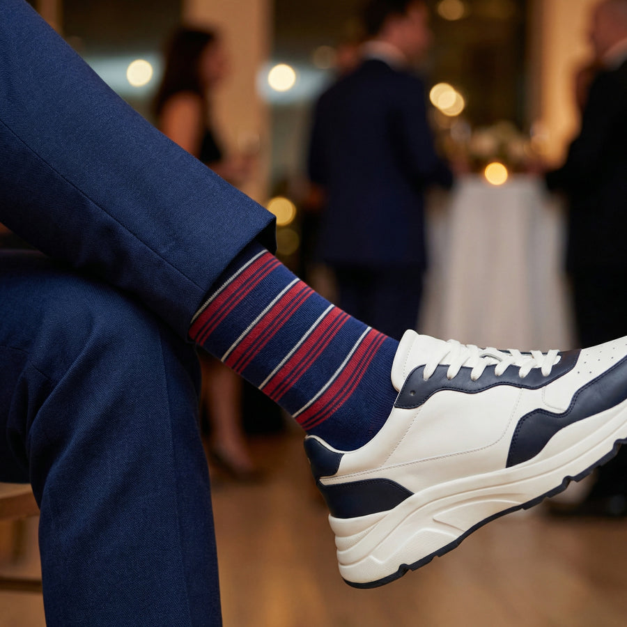 Tommy stripe dress socks styled with sneakers for casual wear