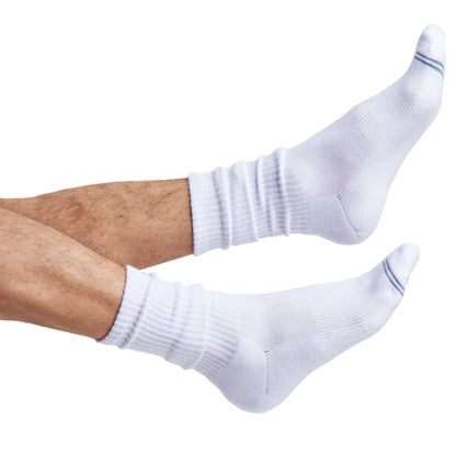 one pair of white crew socks with two accents on the toe shown on foot.