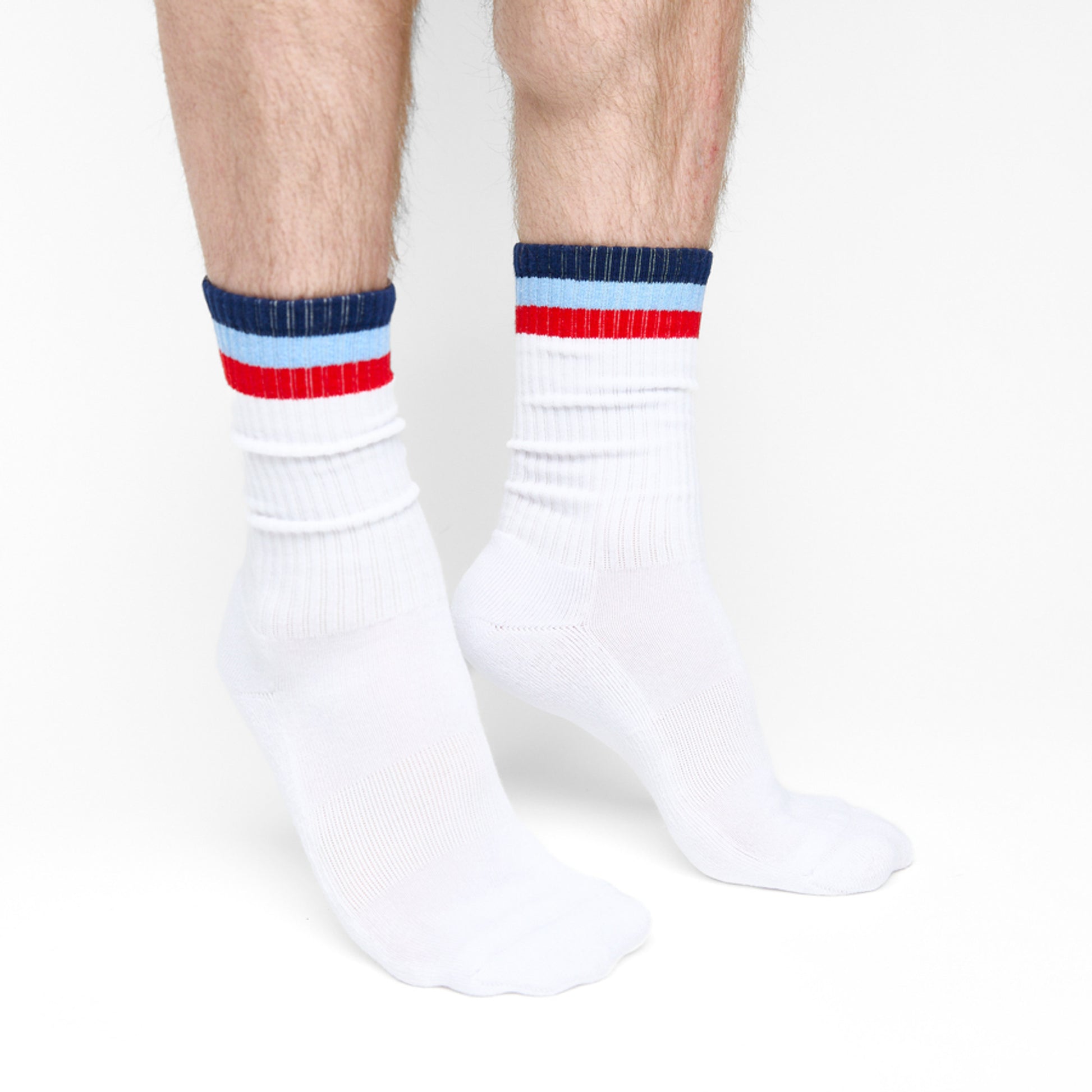 group shot with white crew socks with 4 thin stripes on the leg product shown