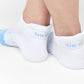 White and powder blue 50/50 ankle socks with two accent stripes around the toe.