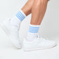 white crew socks with 4 thin stripes on the leg