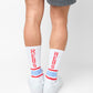 White crew socks with stripes on the ankles and ' REBS ' down the back of the leg.