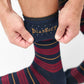 Navy dress socks with deep red stripe and gold accents showing TrueStay‚Ñ¢ grip in welt