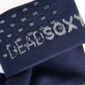 close up view of navy sock welt with TrueStay‚Ñ¢ silicone dots