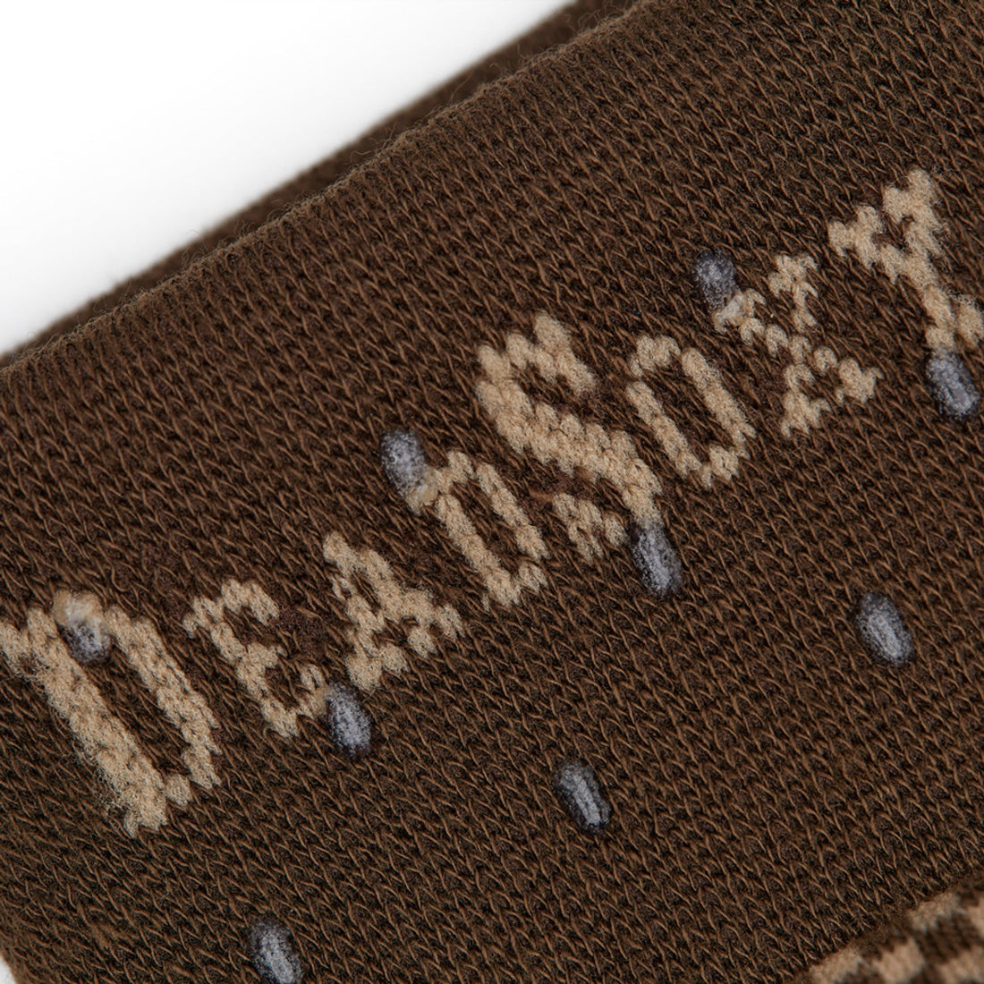 close up of the welt and DeadSoxy's TrueStay‚Ñ¢ sock technology in brown dress socks