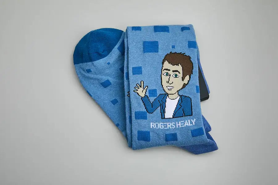 Custom Rogers Healy real estate company branded socks with cartoon mascot by DeadSoxy