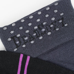 Black and Charcoal dress socks close up image of the TrueStay‚Ñ¢ tech in the welt.
