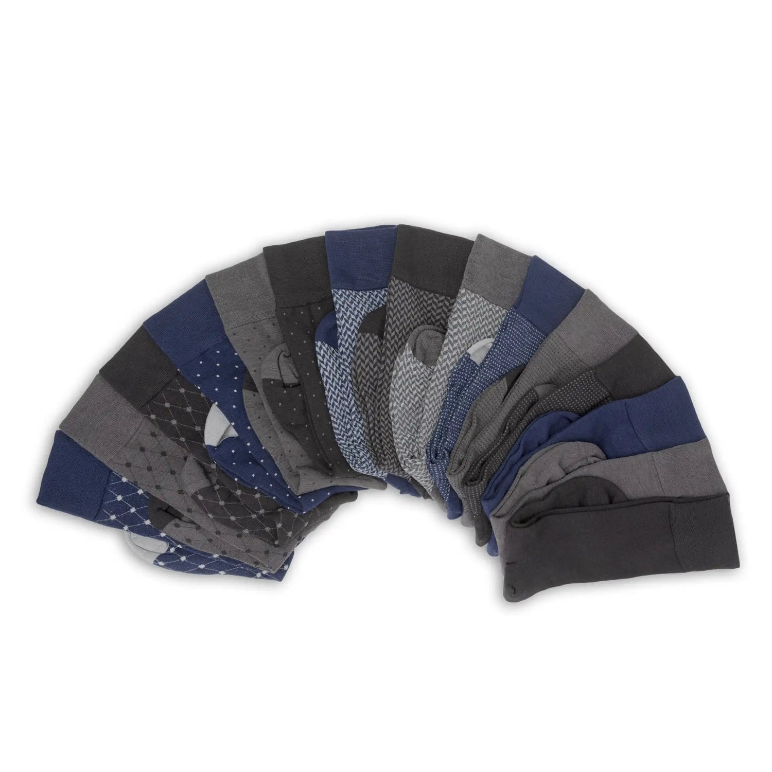 A collection of men’s dress socks in navy, gray, and black with various patterns including polka dots, herringbone, and geometric designs.