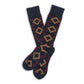 Navy dress socks with yellow and red geometric design laid flat