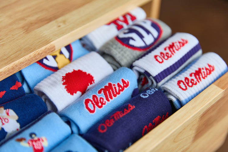 Ole Miss socks in navy, powder blue, red, and white