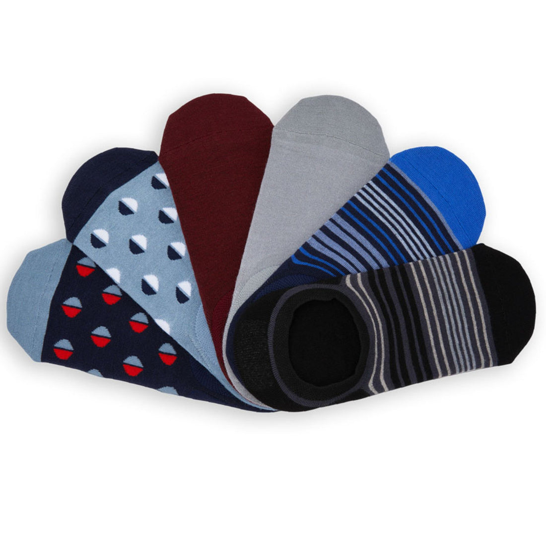 6 pairs of no show socks laid flat v shape with the heels stacked on top and the toes spread apart. 2 with medium sized dots and one solid.