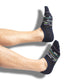 Navy no show socks with a patchwork design on legs.