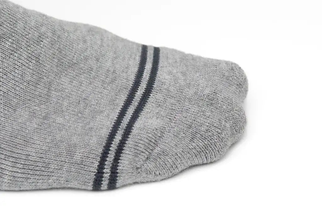 Gray athletic sock with two parallel black stripes near the toe.