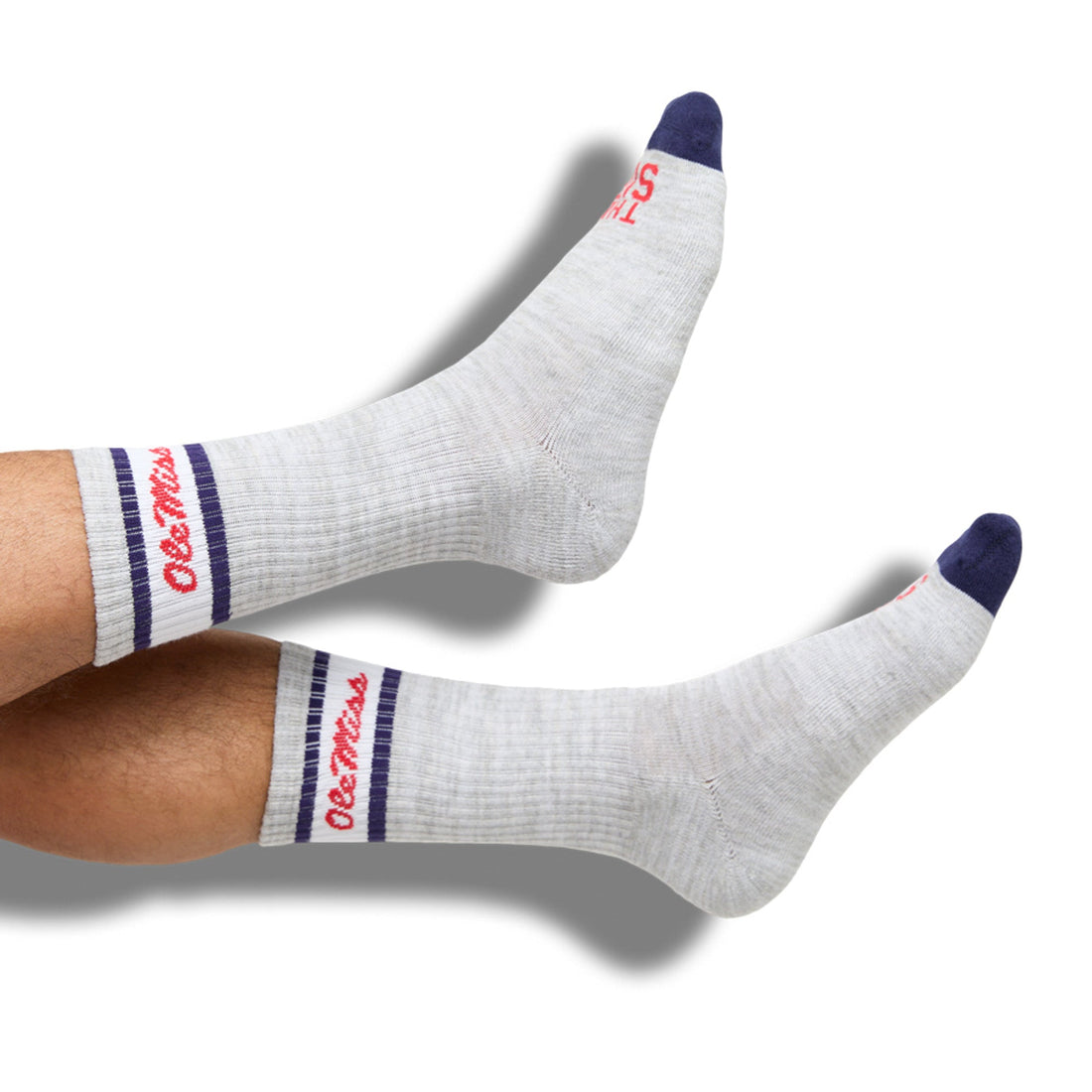 Grey casual crew socks with Ole Miss script on the leg and two retro stripes on floating legs. .