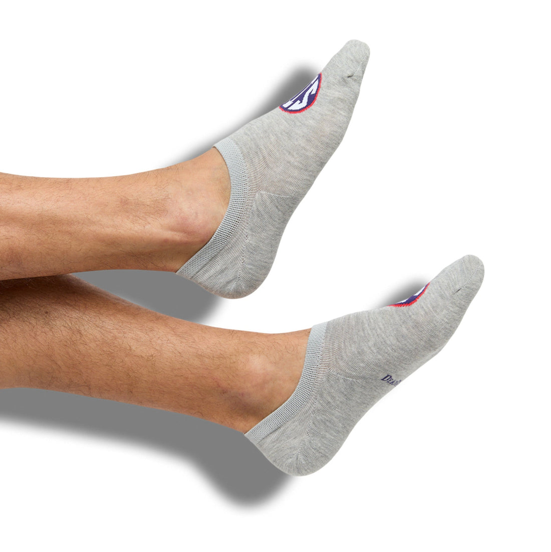Grey no show liner socks with SIP on the top of the foot for Ole Miss on feet.