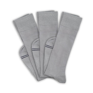 3 grey socks folded at ankle and layered on top of one another