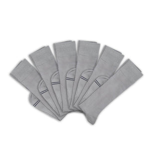 3 grey socks folded at ankle and layered on top of one another