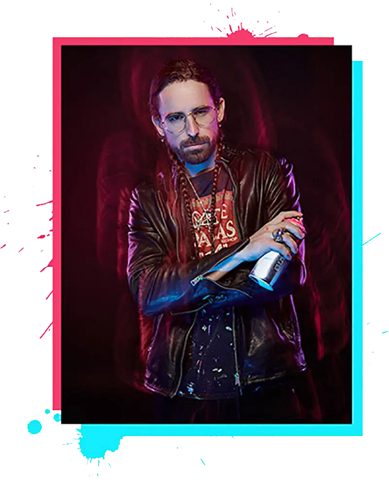 Man wearing a black leather jacket over a graphic tee and holding a silver spray can