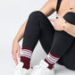 Maroon Retro Howdy Casual Crew Socks with vintage Howdy text in black leggings
