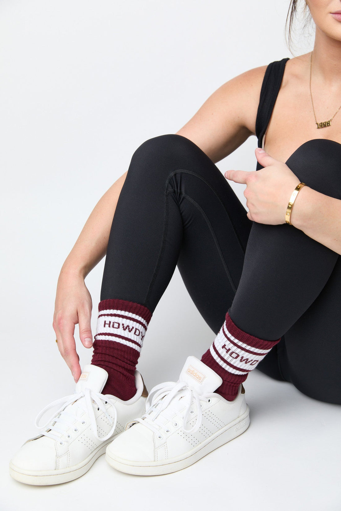 Maroon Retro Howdy Casual Crew Socks with vintage Howdy text in black leggings