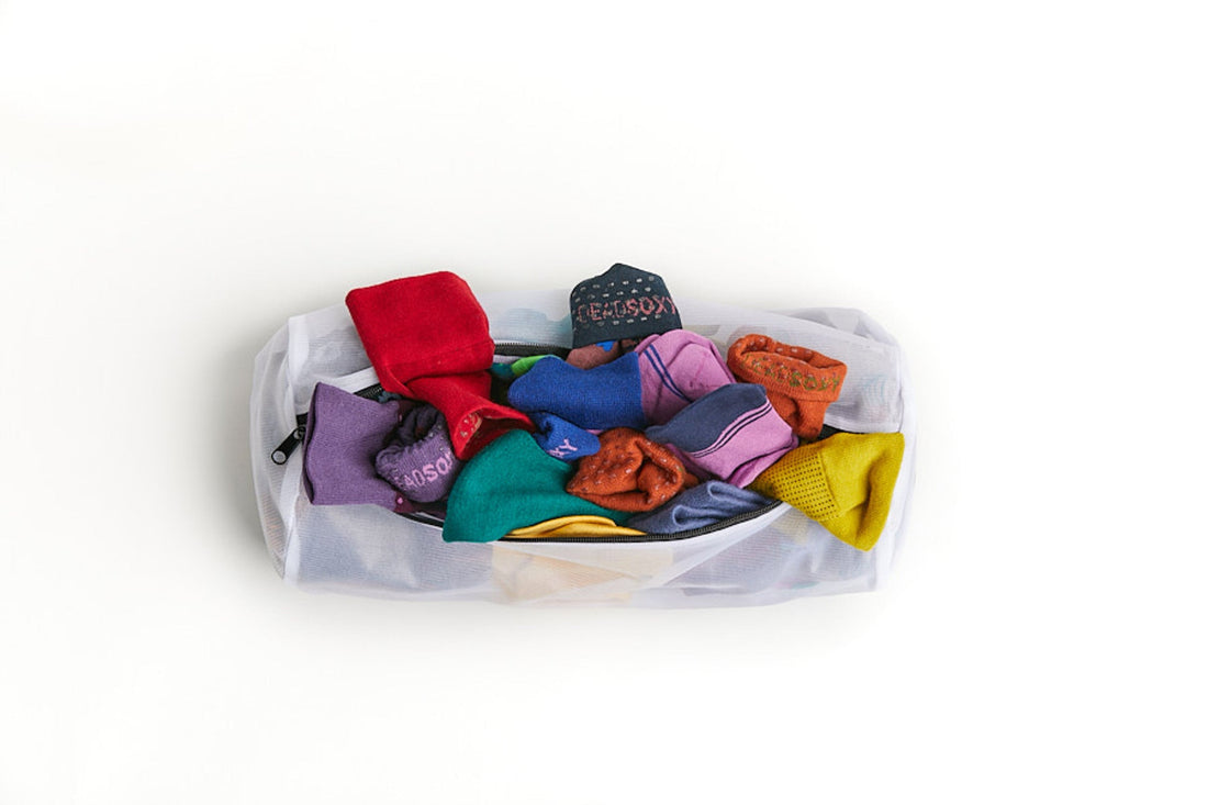 New and Improved Mesh Sock Wash Bag full of DeadSoxy premium bamboo socks.