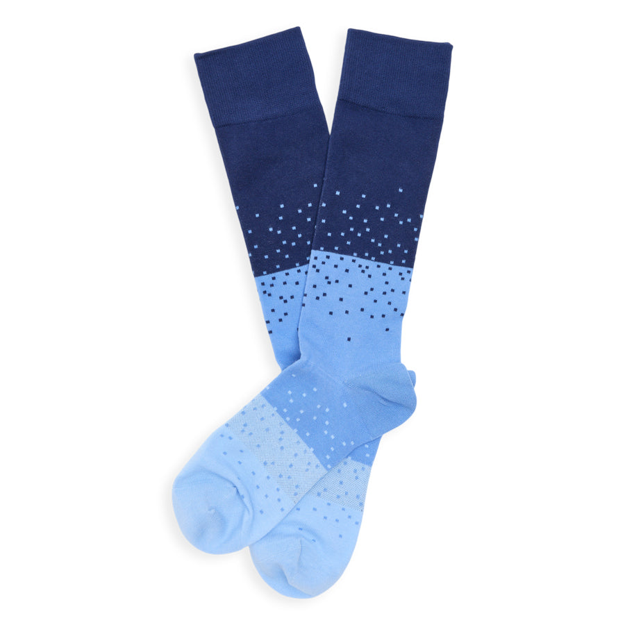 Pair of blue socks with gradient design on a white background