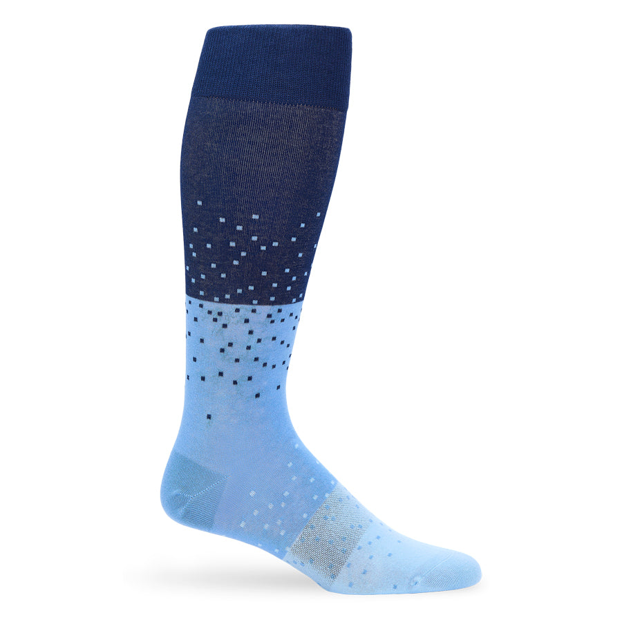Knee-high sock with blue and white polka dot pattern on a white background
