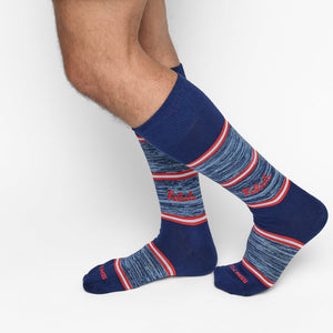 Blue socks with red and white stripes for Ole Miss dress socks with red “REBELS” text on the ankle, shown on a white background.