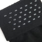 Close up shot of black sock welt featuring clear silicone dots