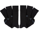 6 pairs of black socks folded at ankle and layered on top of one another