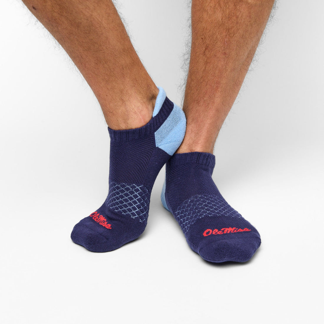 White Ankle socks with powder blue heel and ' THe SIP ' on the back of the heel worn by a man