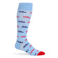 Licensed powder blue dress socks with the Ole Miss script logo in red and navy blue blue in repeating pattern shown on mannequin.