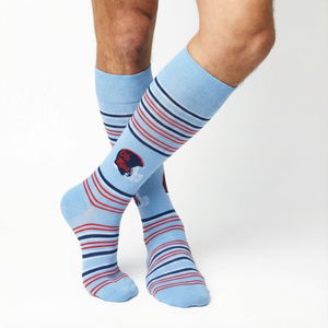 Close up, powder-blue dress socks with navy wave stripes and helmet and Ole Miss script accent