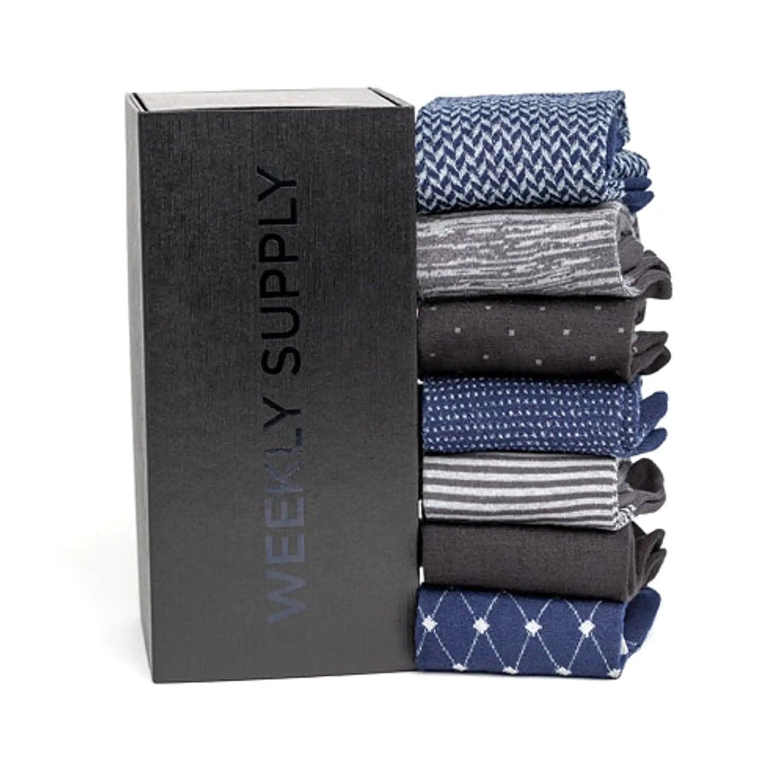 Stack of neatly folded men’s dress socks in assorted patterns and shades of blue, gray, and black.