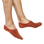 No show socks on man solid burnt orange with a double horizontal green stripe over the toe