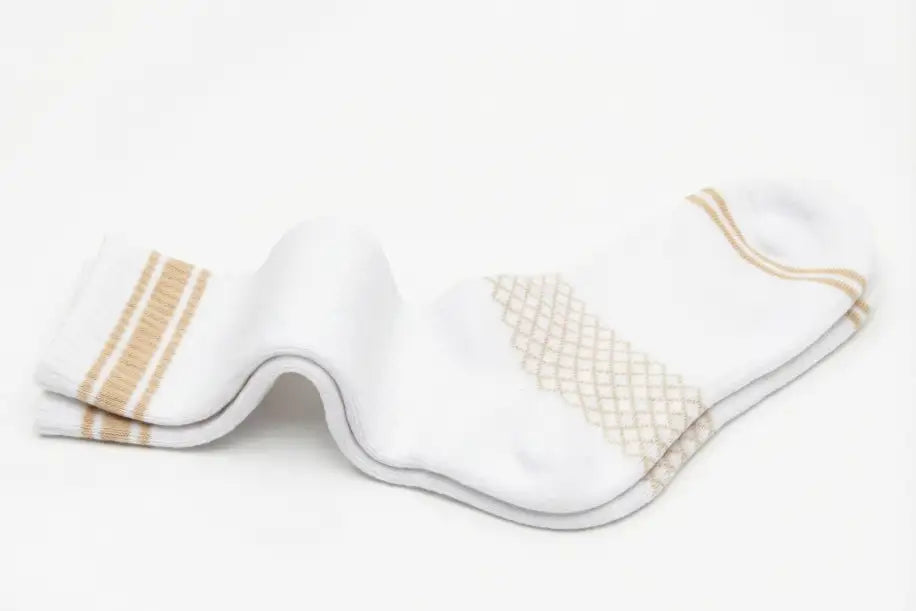 White athletic sock with beige stripes and a diamond-patterned accent on the foot.