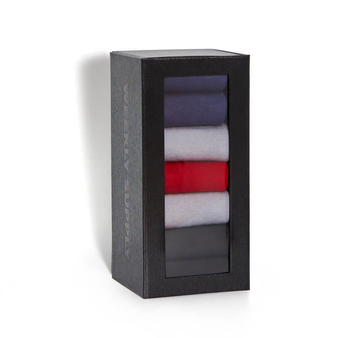 Weekly Supply dress socks in their box on a white background