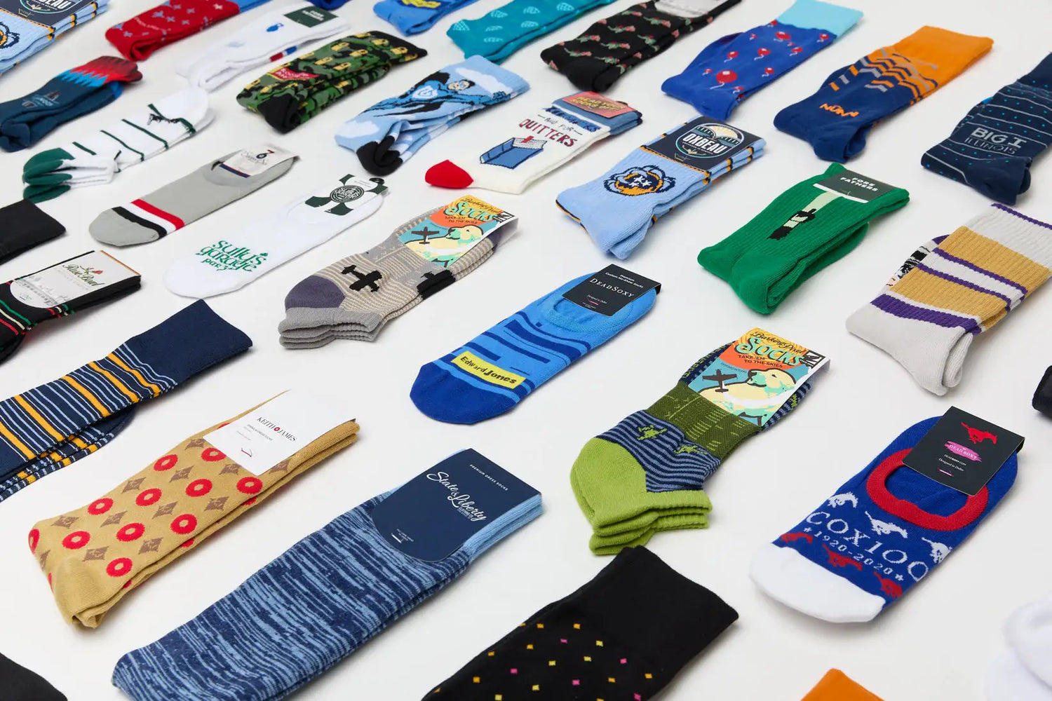 A wide assortment of custom branded socks arranged in rows